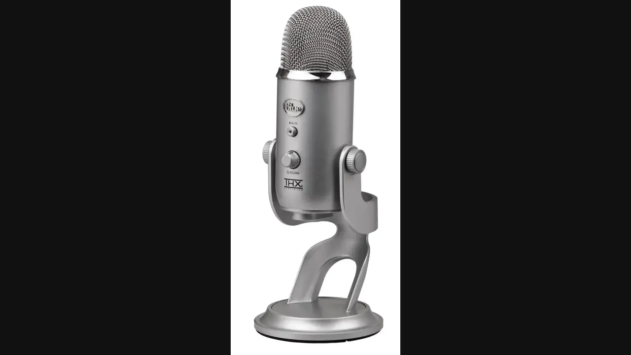 A Blue Yeti USB microphone by Blue Microphones, photographed 12 August 2011 on a plain background. The lead image fits that tall Commons photograph into a 16:9 frame. The microphone in the photograph is not the Blackout color on the Amazon listing. Photo by Evan-Amos, public domain, via Wikimedia Commons.