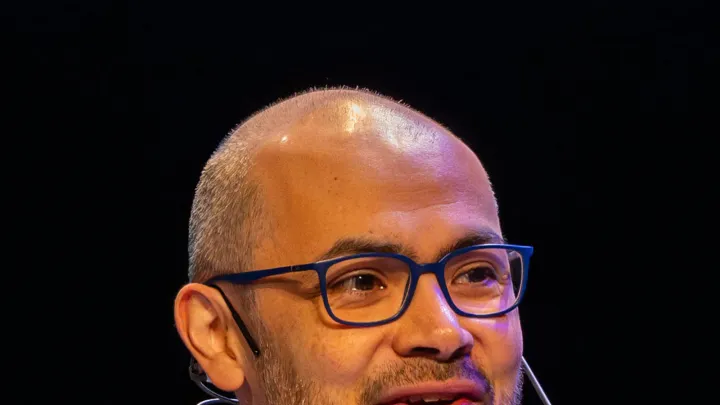 Demis Hassabis at the 2024 Nobel Prize press conference in Stockholm. Photo by Arthur Petron, CC BY-SA 4.0, via Wikimedia Commons.