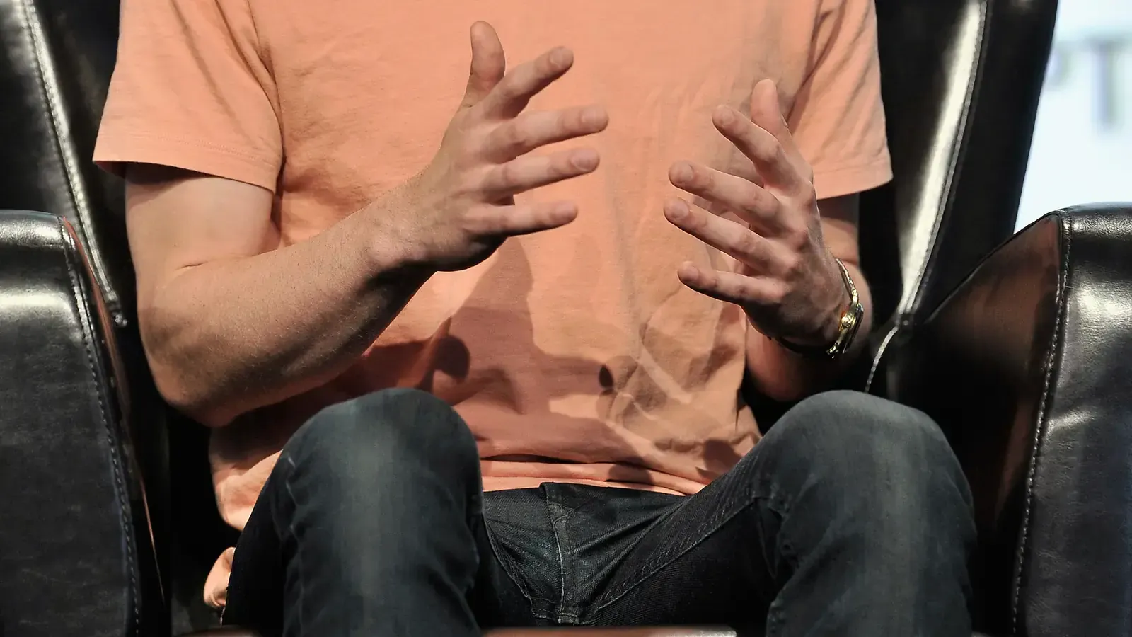 Sam Altman speaking on stage at TechCrunch Disrupt in San Francisco on 19 September 2017, in a light gray blazer over a black shirt, at a podium against a dark backdrop. Photo by Steve Jennings / Getty Images for TechCrunch, CC BY 2.0, via Wikimedia Commons.