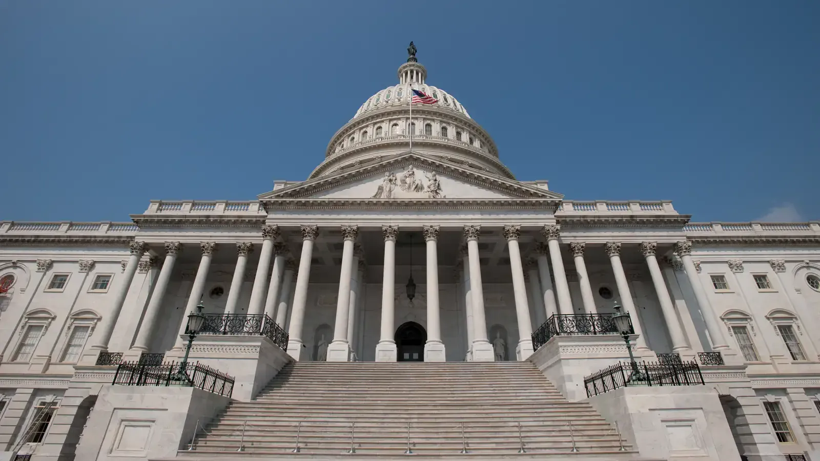 The east front of the United States Capitol in Washington, D.C., dome and steps, photographed 4 August 2009. Photo by Bill Koplitz, FEMA, public domain, via Wikimedia Commons.
